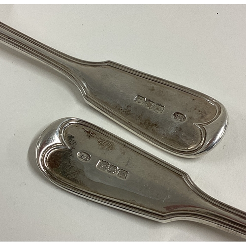 660 - A heavy pair of silver fiddle and thread pattern ladles. London. By RS. Approx. 132 grams. Est. £50 ... 