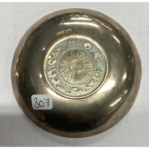 307 - WANG HING: A Chinese export silver coin dish. Marked to base. Approx. 70 grams. Est. £60 - £80.