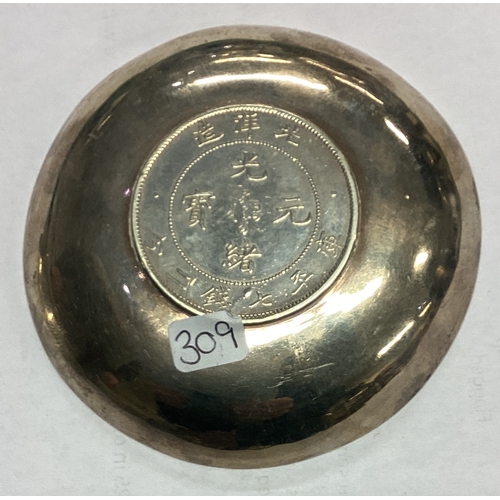 309 - WANG HING: A Chinese export silver coin dish. Marked to base. Approx. 71 grams. Est. £60 - £80.