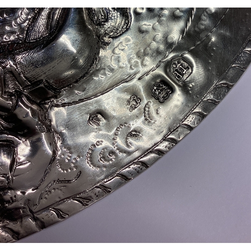 750 - An important Charles II silver charger with original chased decoration and central armorial. London ... 