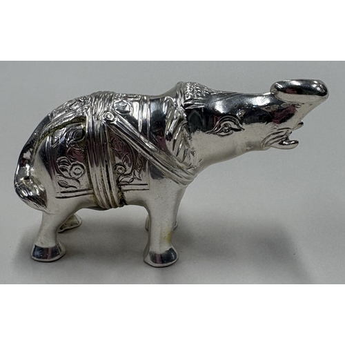 108 - A heavy cast silver figure of an elephant. Approx. 132 grams. Est. £120 - £150.