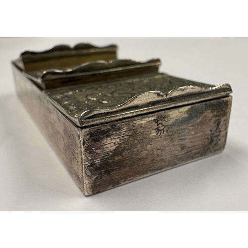 137 - An 18th Century silver triple pill box with chased decoration. Marked to side. Approx. 38 grams. Est... 