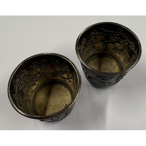 139 - A pair of 19th Century Chinese export silver vases with textured decoration. Marked to bases. Approx... 