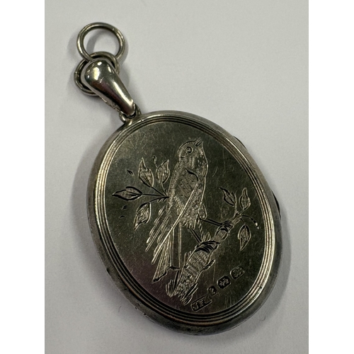 143 - A rare Aesthetic Movement Victorian silver and enamelled locket depicting a stork with engraved bird... 