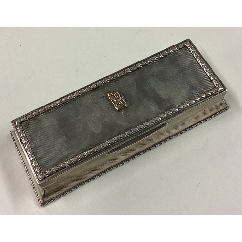 145 - A large silver combination snuff box with gold plaque to centre and striker to side. London 1919. By... 