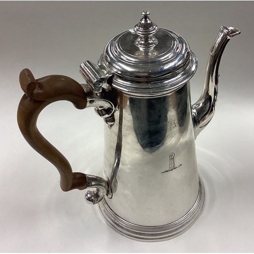 148 - A large and impressive 18th Century George II silver coffee pot decorated with hand crest. Fully mar... 