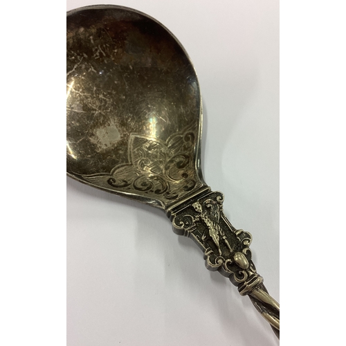 150 - A fine quality engraved Continental silver spoon with chased decoration to fluted handle. Approx. 70... 