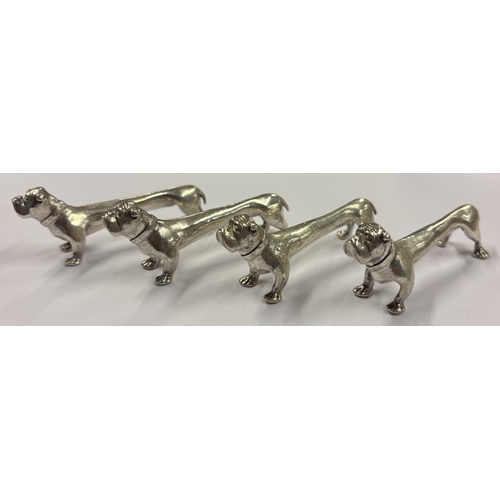 161 - A set of four silver knife rests in the form of dogs. London 1997. By Nat Leslie Ltd. Approx. 87 gra... 