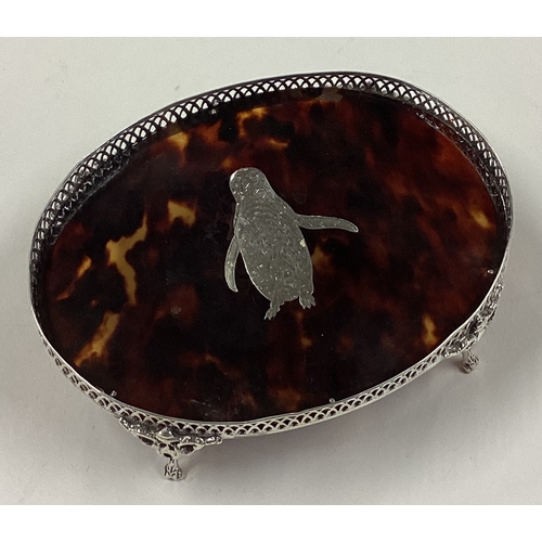 162 - A rare silver and tortoiseshell teapot stand inlaid with penguin decoration. London 1913. Approx. 61... 