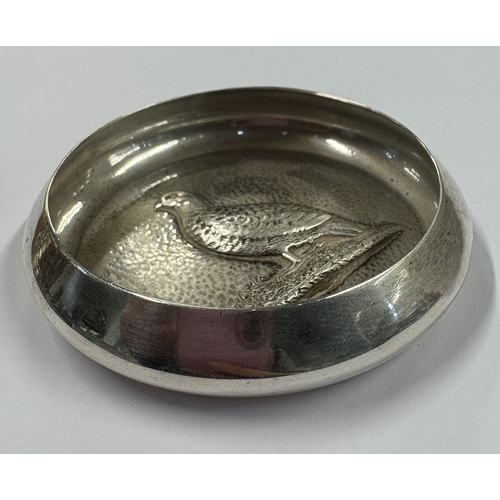 164 - An unusual silver dish embossed with a partridge. London 1913. By Goldsmiths & Silversmiths. Approx.... 