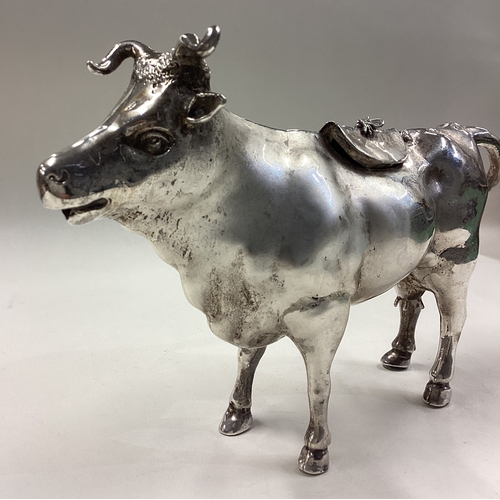 174 - A large and impressive Naturalistic Victorian silver cow creamer bearing import marks. Marked to bas... 