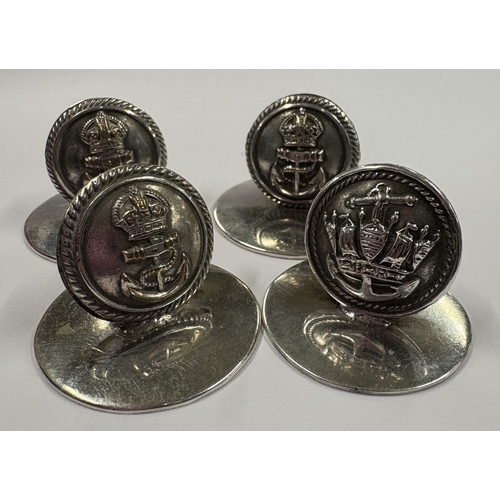 179 - A matched set of four silver menu holders with crested decoration. Approx. 43 grams. Est. £50 - £80.