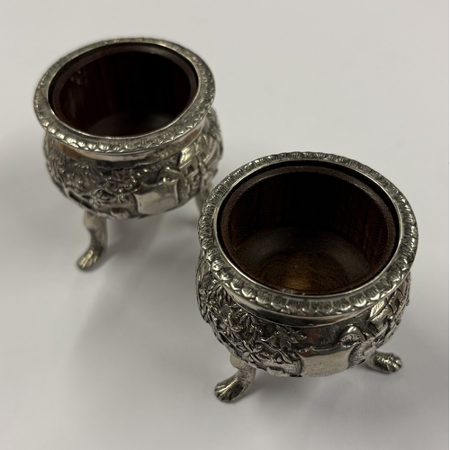 181 - A pair of Chinese export silver salts chased with figures. Marked to base. Circa 1860. By YL. Approx... 