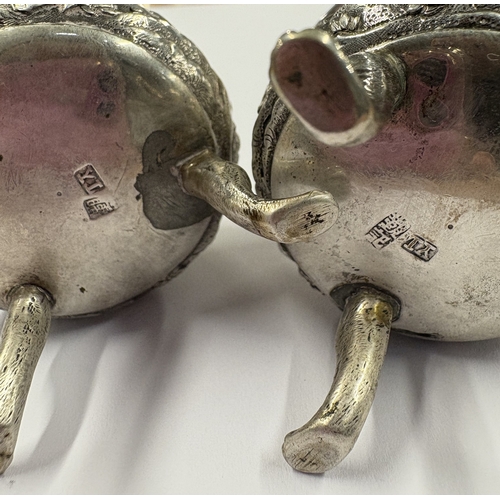 181 - A pair of Chinese export silver salts chased with figures. Marked to base. Circa 1860. By YL. Approx... 