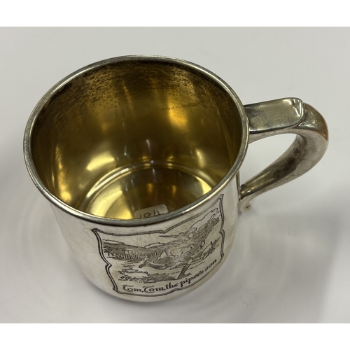 184 - A novelty American silver christening mug depicting 'Little Boy Blue and Tom, Tom the Piper's Son'. ... 