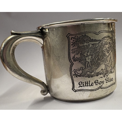 184 - A novelty American silver christening mug depicting 'Little Boy Blue and Tom, Tom the Piper's Son'. ... 