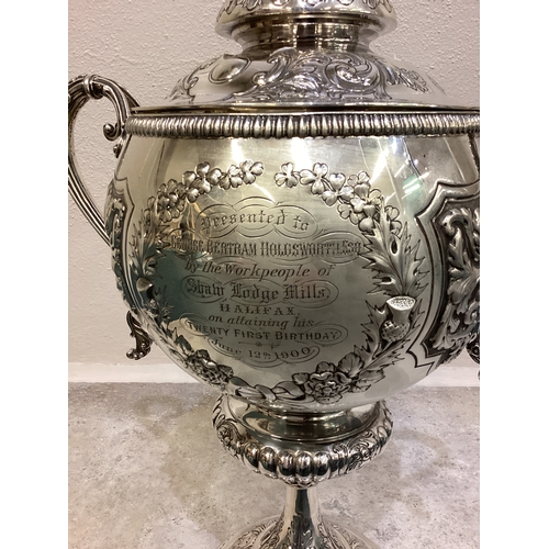 189 - A large and impressive chased Victorian silver cup and cover with figural finial presented by 'Shaw ... 