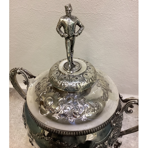 189 - A large and impressive chased Victorian silver cup and cover with figural finial presented by 'Shaw ... 