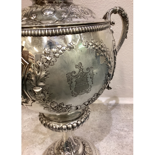 189 - A large and impressive chased Victorian silver cup and cover with figural finial presented by 'Shaw ... 