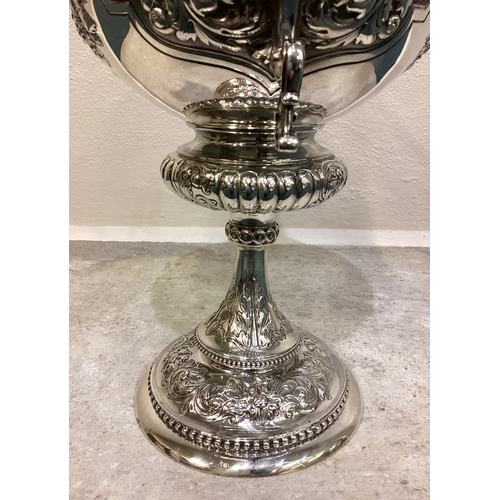 189 - A large and impressive chased Victorian silver cup and cover with figural finial presented by 'Shaw ... 