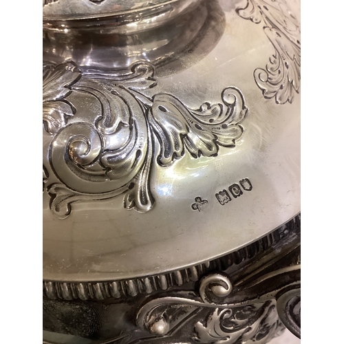 189 - A large and impressive chased Victorian silver cup and cover with figural finial presented by 'Shaw ... 