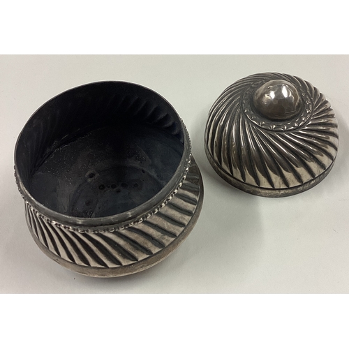 195 - A heavy Continental silver box with swirl fluting. Approx. 118 grams. Est. £40 - £60.