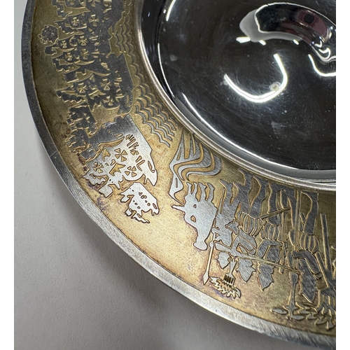 20 - GARRARD & CO: A rare cased silver and silver gilt dish with chased figural decoration to borders. Lo... 