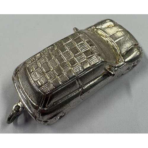 208 - A heavy Sterling silver toy model of a car. Approx. 21 grams. Est. £20 - £30.