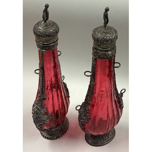 214 - A pair of 18th / 19th Century silver mounted cranberry glass flasks. Est. £500 - £800.