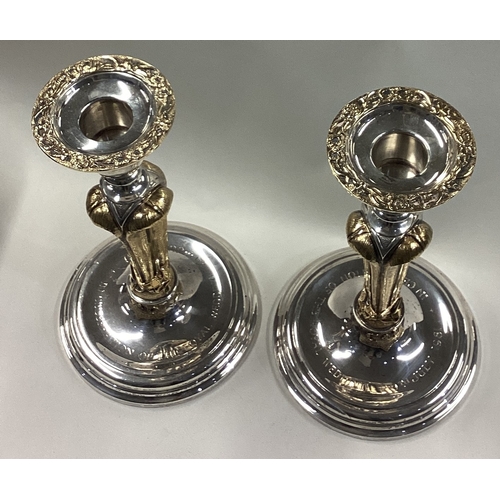 218 - A fine pair of silver and silver gilt candlesticks commemorating The Royal Wedding of Prince Charles... 