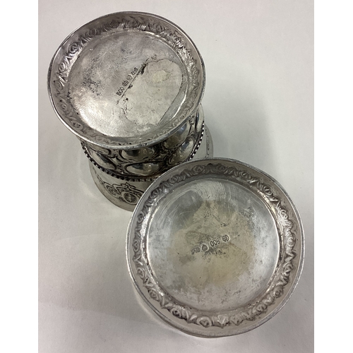 243 - A pair of Continental silver beakers. Approx. 314 grams. Est. £300 - £400.