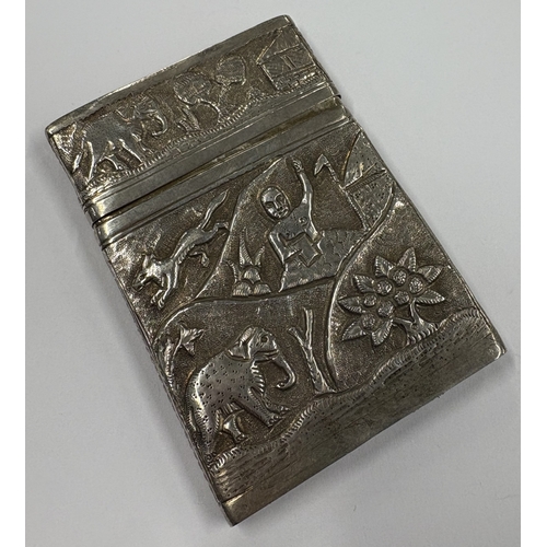 247 - A 19th Century Indian Kutch silver card case with lift-off cover embossed with figures. Approx. 86 g... 