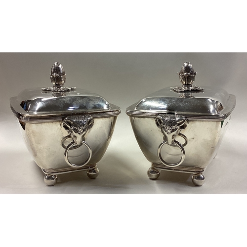 251 - A pair of George III silver sauce tureens and covers with crested decoration. London 1800. By John R... 