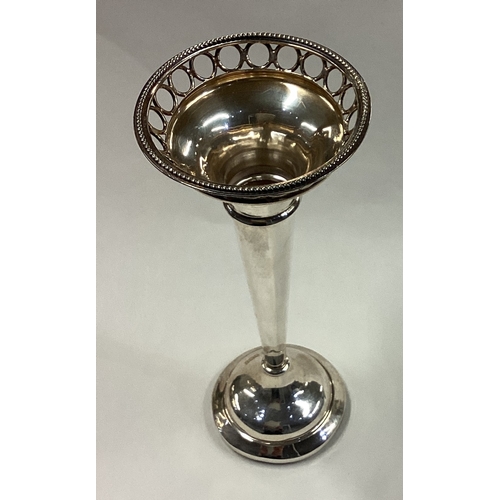 264 - A large silver vase with pierced decoration. Sheffield 1915. Approx. 93 grams. Est. £100 - £150.