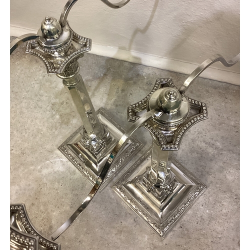 269 - A fine pair of Judaica silver candelabras of classical design chased with lion decoration. London 19... 