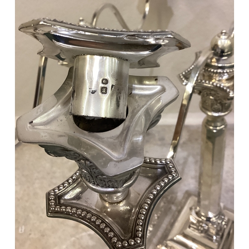 269 - A fine pair of Judaica silver candelabras of classical design chased with lion decoration. London 19... 