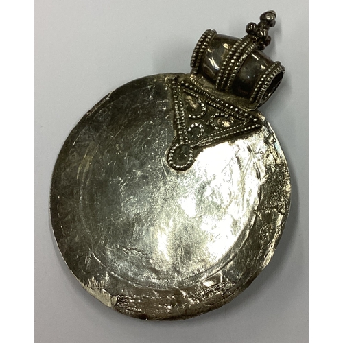 274 - A large Continental silver medallion of Eastern form. Approx. 118 grams. Est. £80 - £120.