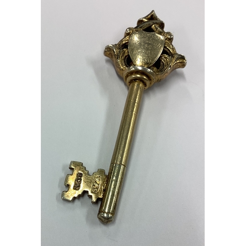 3 - A cast silver gilt model of a key. Birmingham. Approx. 20 grams. Est. £20 - £30.