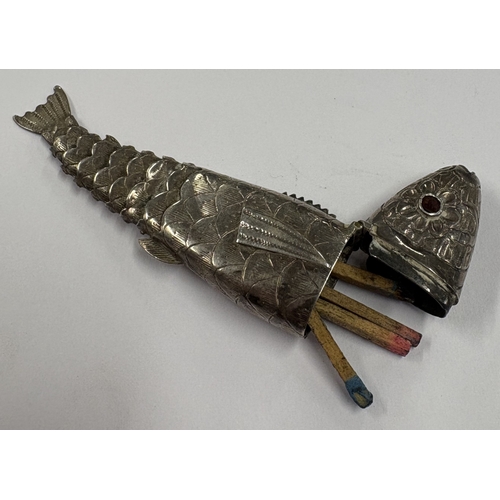 301 - An Antique 19th Century silver box with hinged cover in the form of an articulated fish. Approx. 14 ... 