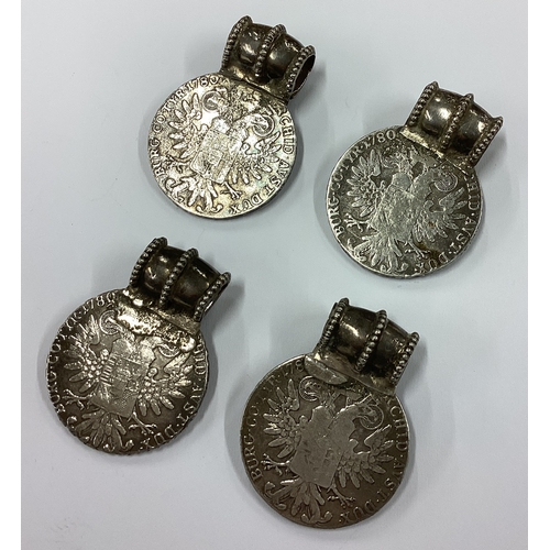 302 - A set of four Continental silver medallions with loop tops. Approx. 140 grams. Est. £60 - £80.