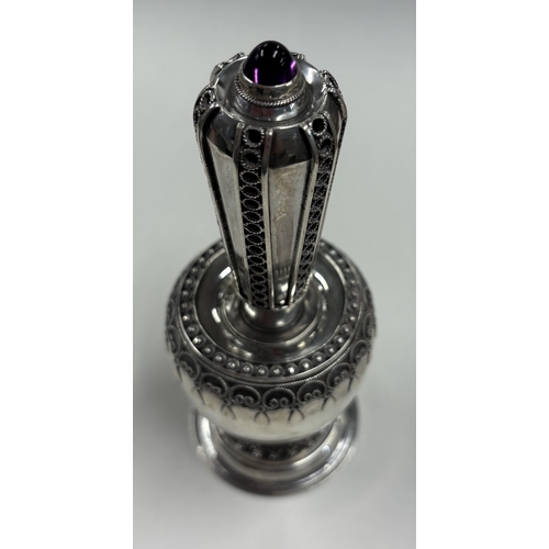 310 - A Judaica silver spice tower with stone decoration. Approx. 153 grams. Est. £150 - £200.