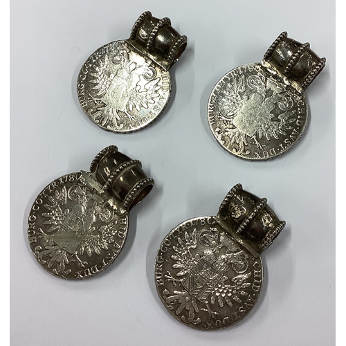 348 - A group of four heavy silver medallions with loop tops. Approx. 140 grams. Est. £60 - £80.