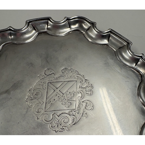 359 - A George II silver salver on feet with central armorial. London 1732. By Charles Martin. Approx. 183... 