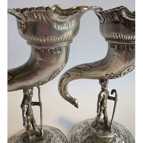 382 - An impressive pair of novelty figural Victorian silver vases bearing import marks. Marked to bodies.... 