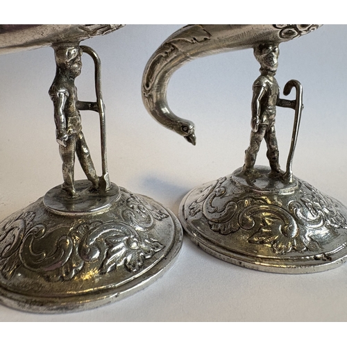 382 - An impressive pair of novelty figural Victorian silver vases bearing import marks. Marked to bodies.... 