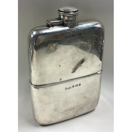 395 - A large silver flask with detachable cover. Birmingham 1915. By D&A. Approx. 343 grams. Est. £400 - ... 