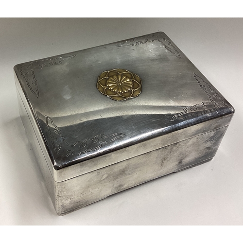 409 - A heavy Japanese Meiji silver and gold table cigar box with lift-off cover. Marked to base. Circa 19... 