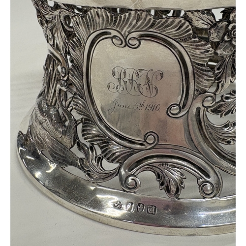 410 - DUBLIN: An Irish silver dish ring pierced with swans, cows and Chinoiserie decoration. 1915. By Wake... 