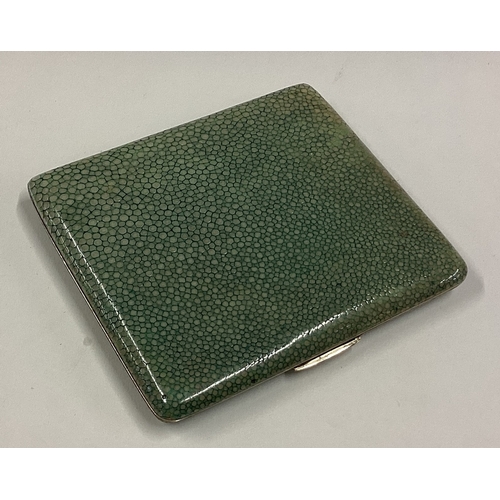 421 - A white metal and shagreen cigarette case. Est. £30 - £40.