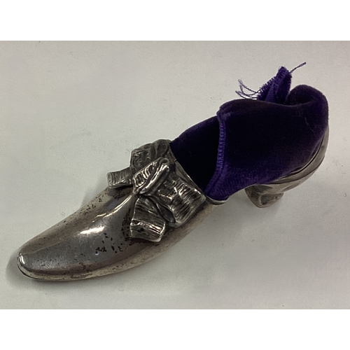 429 - A silver pin cushion in the form of a shoe with swag decoration. Birmingham 1897. Approx. 20 grams. ... 